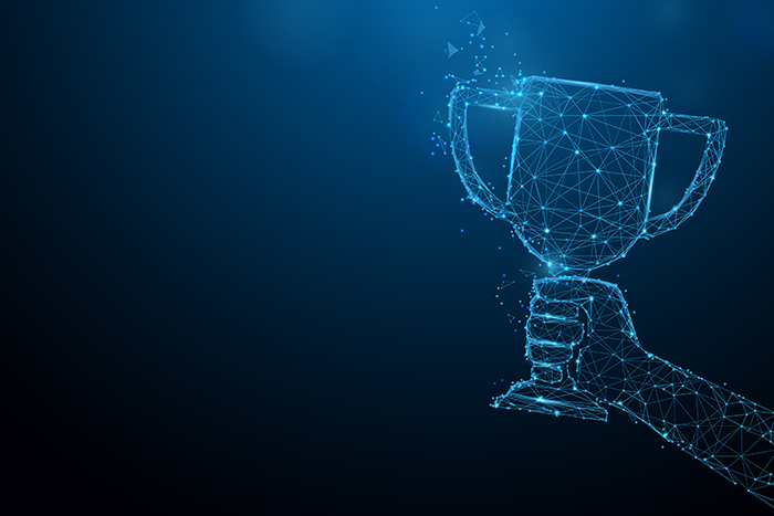 Hand holding trophy cup tophy form lines, triangles and particle